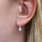 silver opal earrings on